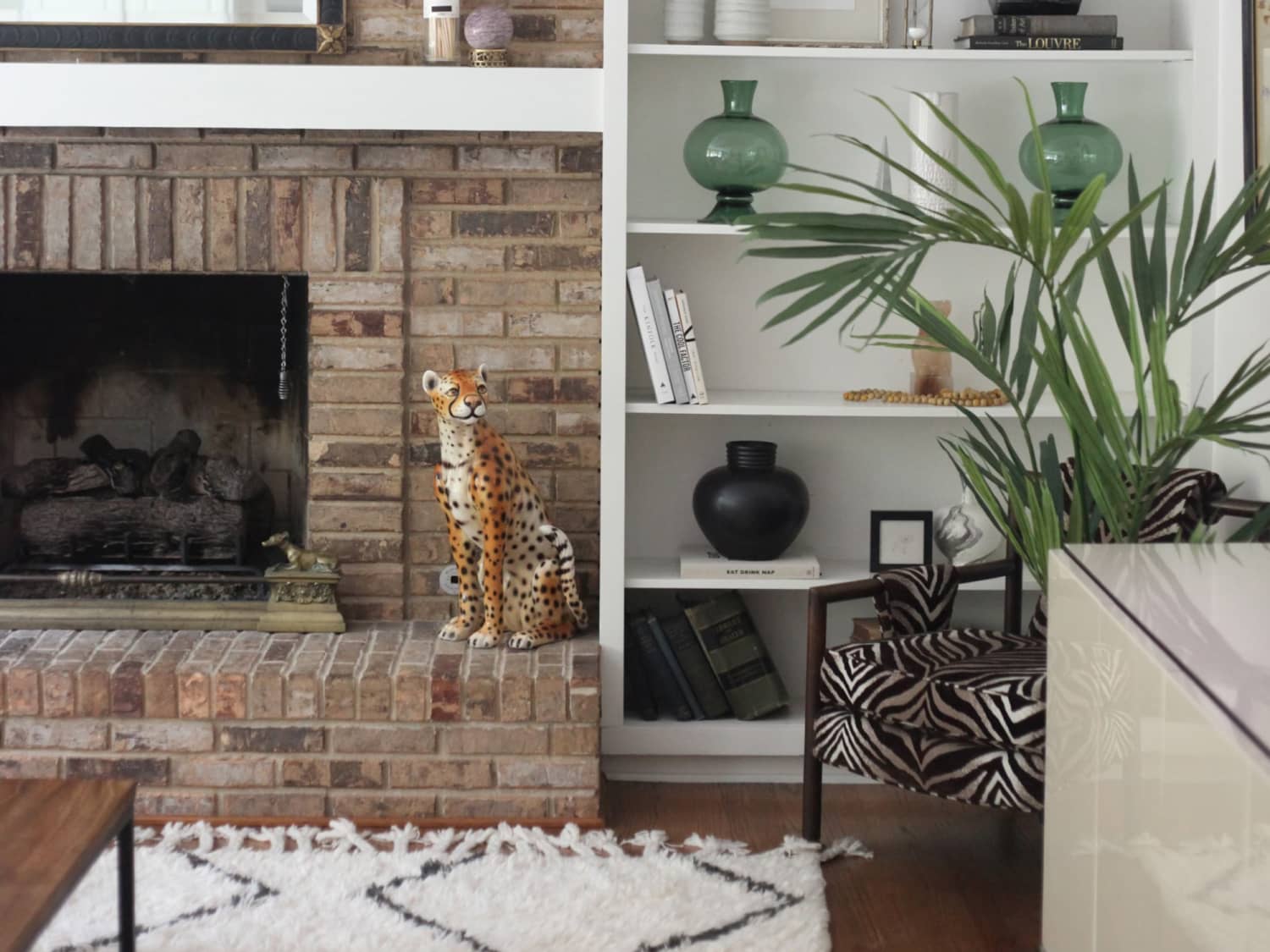 Brick fireplace with shop built in shelves