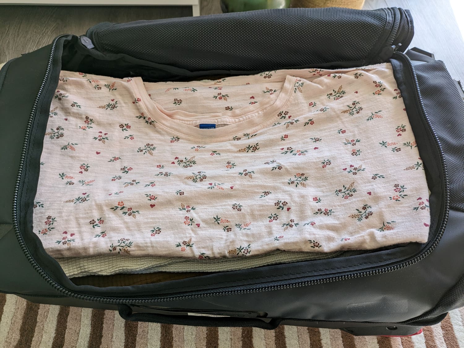 Folding clothes for packing top