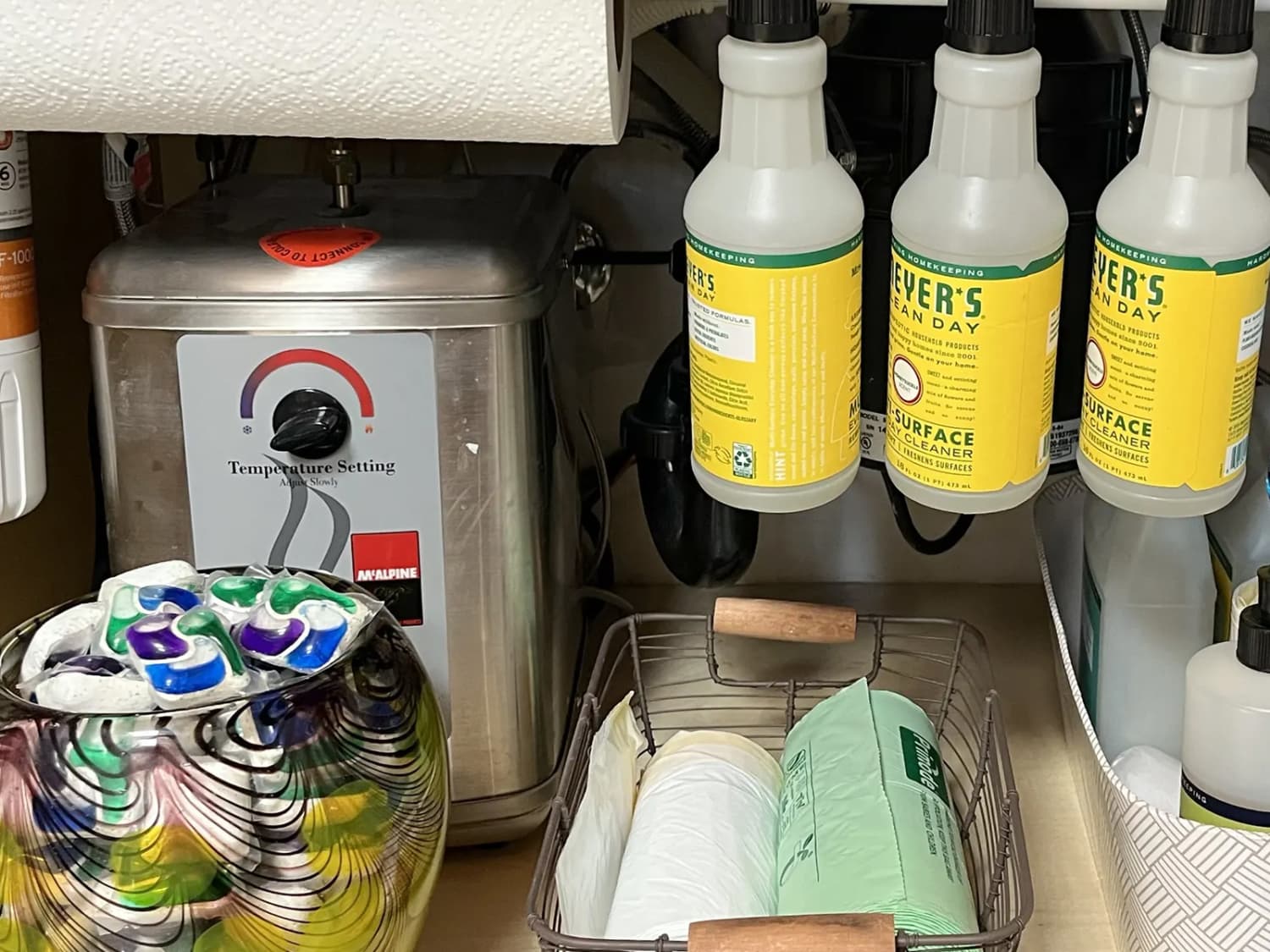 Use a tension rod to increase storage space under the sink - CNET