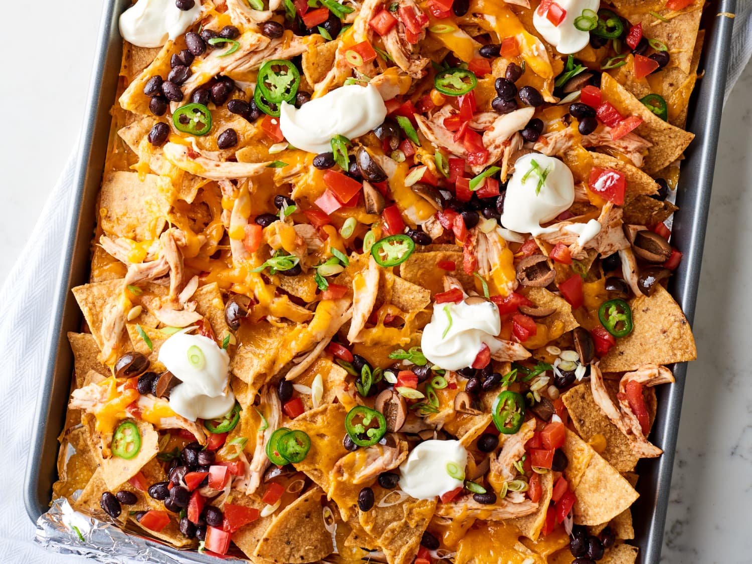 Easy Chicken Nachos Recipe (Using Rotisserie Chicken)