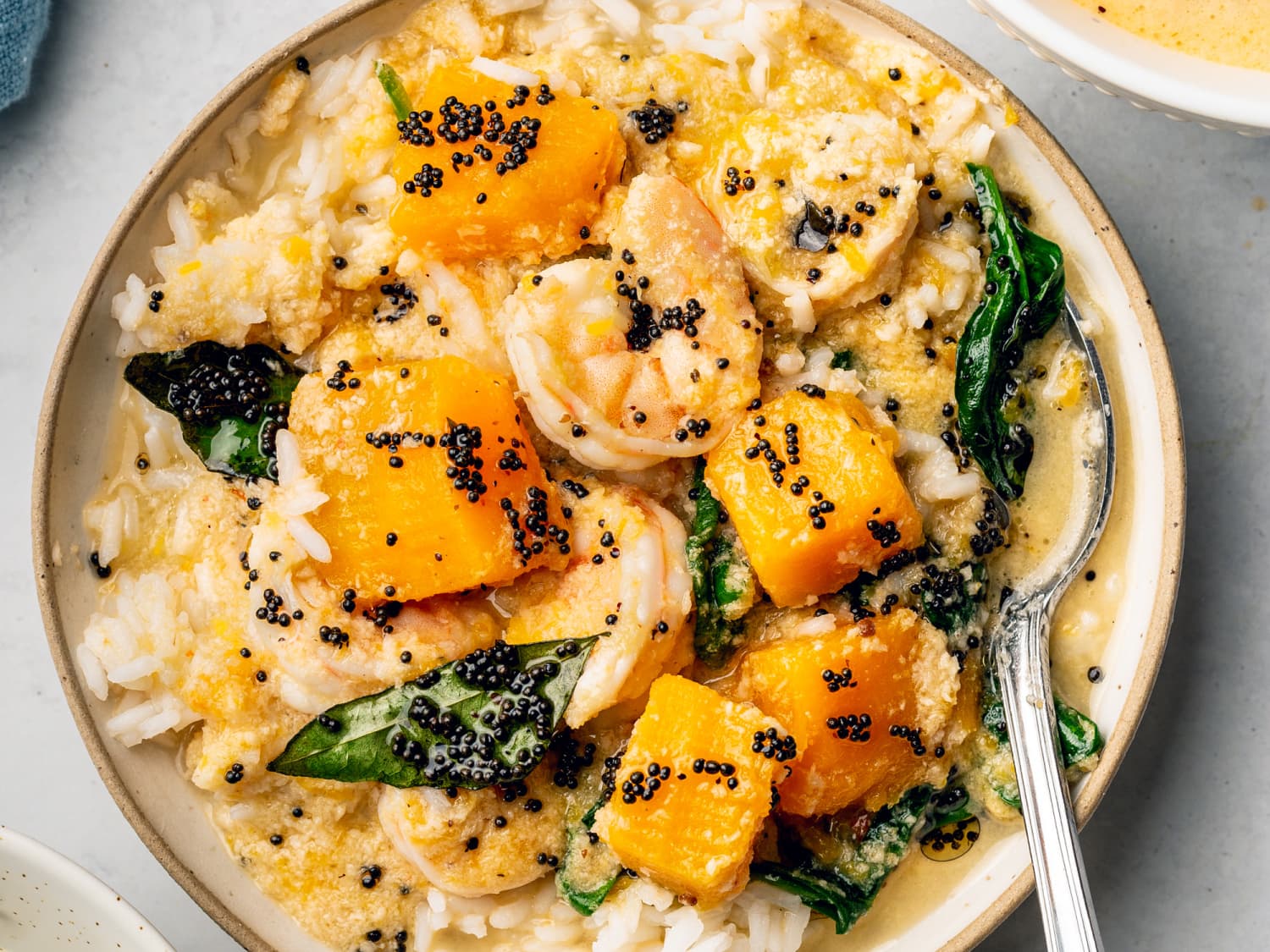 https://cdn.apartmenttherapy.info/image/upload/f_jpg,q_auto:eco,c_fill,g_auto,w_1500,ar_4:3/k%2FPhoto%2FRecipes%2F2021-02-butternut-squash-shrimp-curry%2FTheKitchnShrimpCurry_11_of_13