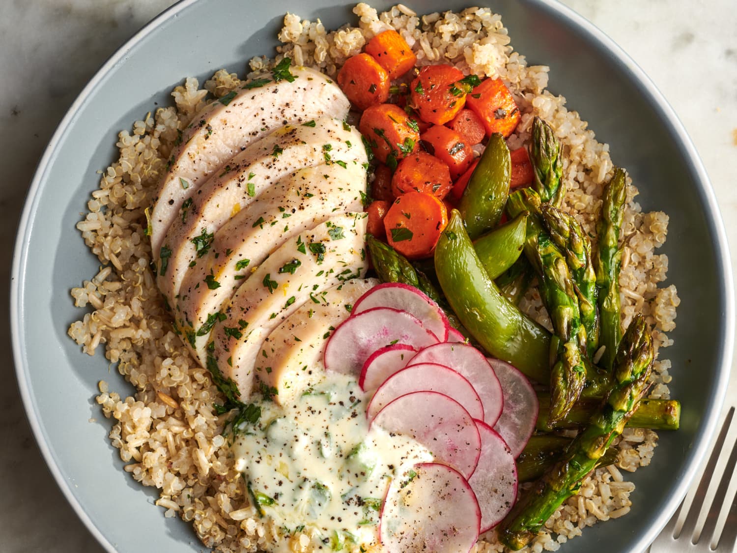 https://cdn.apartmenttherapy.info/image/upload/f_jpg,q_auto:eco,c_fill,g_auto,w_1500,ar_4:3/k%2FPhoto%2FRecipes%2F2022-03_Herby-Chicken-Grain-Bowls%2F2022-02-22_ATK-2050