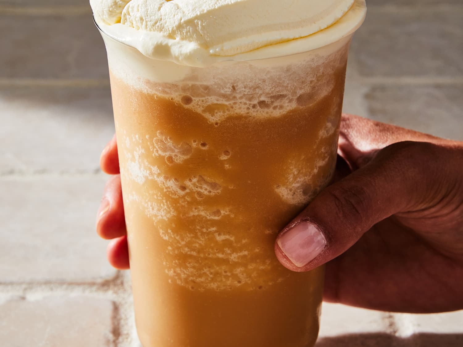 Iced Coffee Cocktail Or Frappe With Ice Cubes And Cream In
