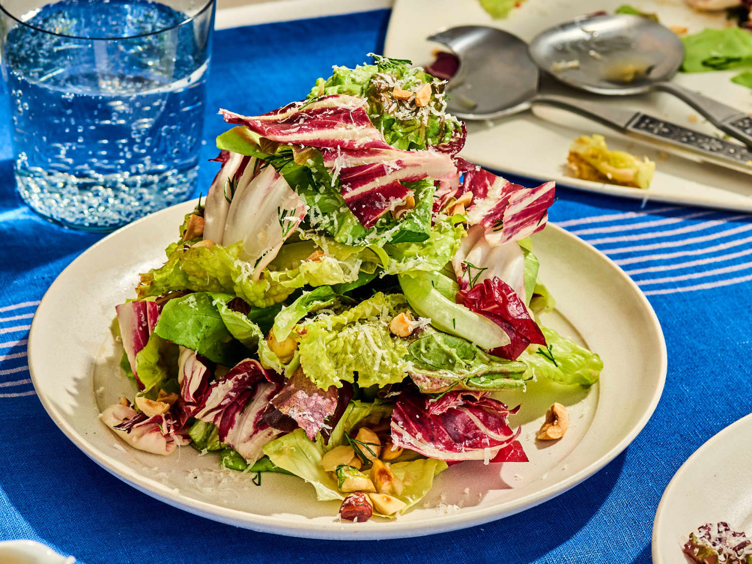 how to serve salad dressing at a dinner party The Ultimate Dinner Party Salad: Mile-High Salad with Hazelnuts, Parmesan,  and Red Wine Vinaigrette
