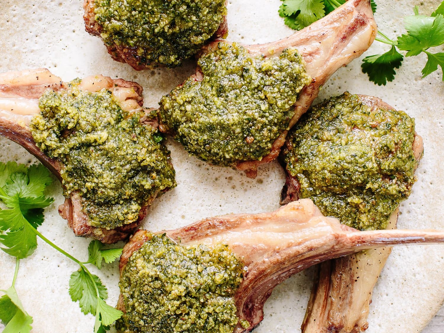 Pesto crusted lamb chops plated