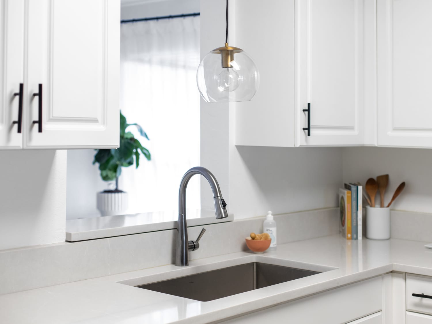 pics of bronzed pendant light over kitchen sink