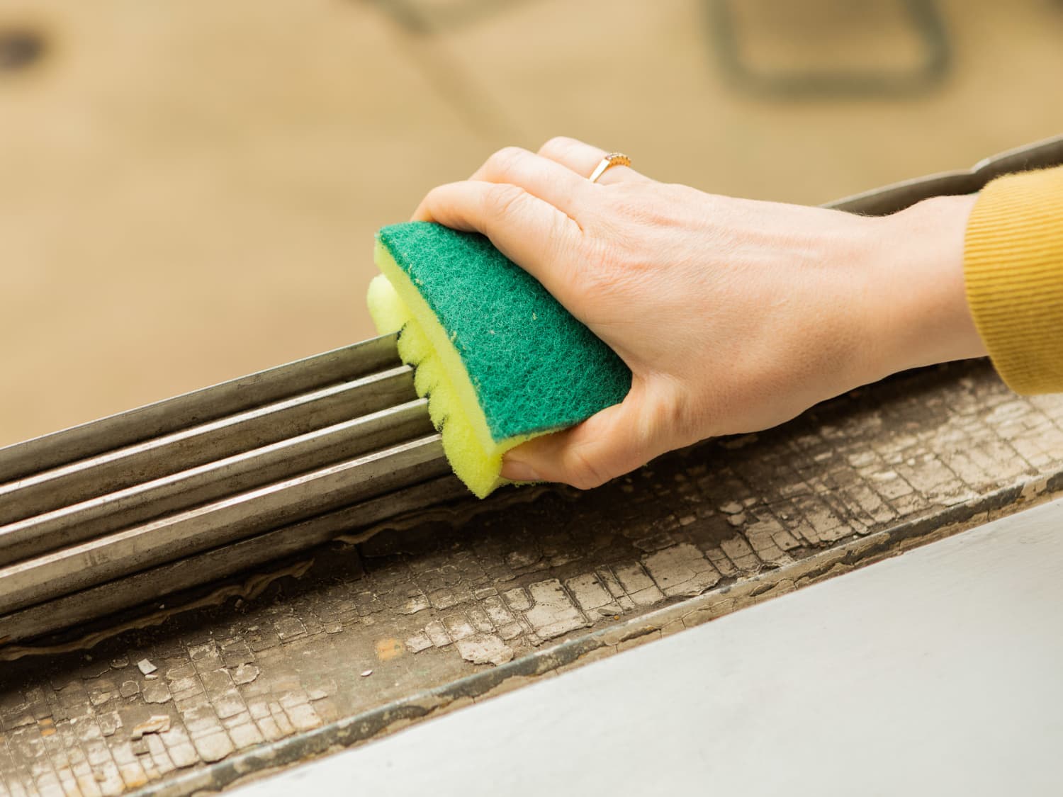 I Tried the Cut Up Sponge Trick for Cleaning Window Tracks