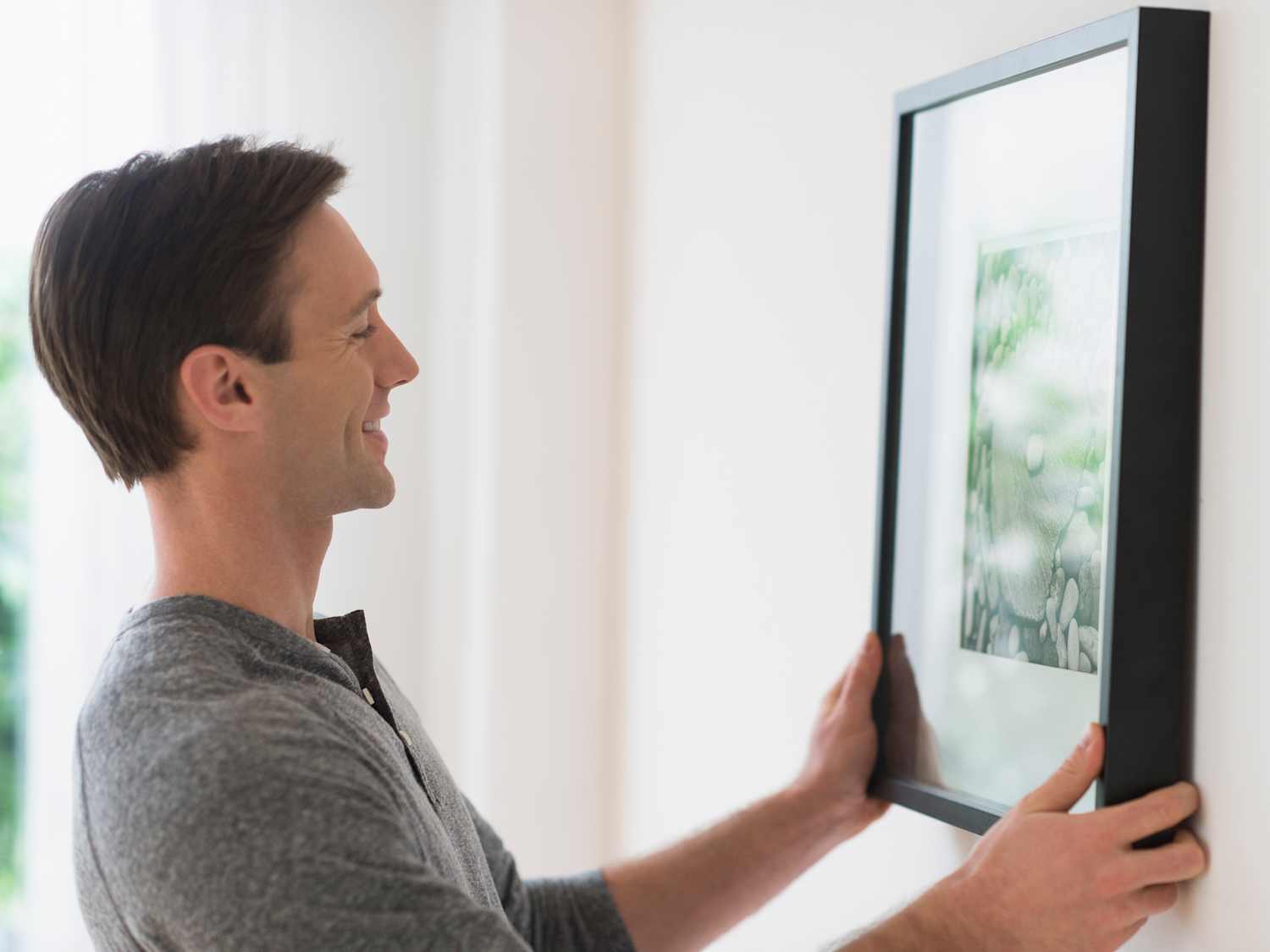 This Picture Frame Hack Will Hide All Your Cables | Apartment Therapy