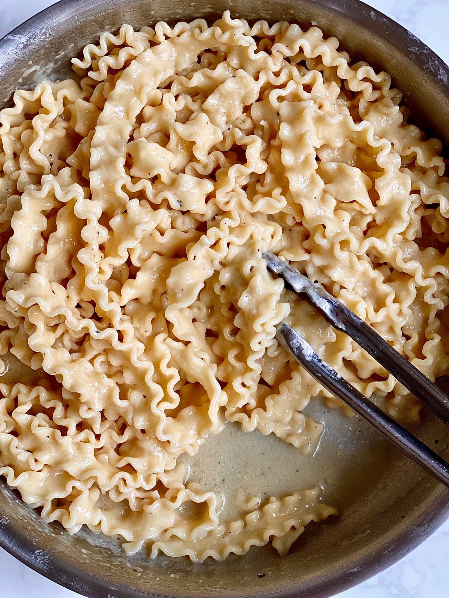 The Surprising Staple That Majorly Upgrades Buttered Noodles