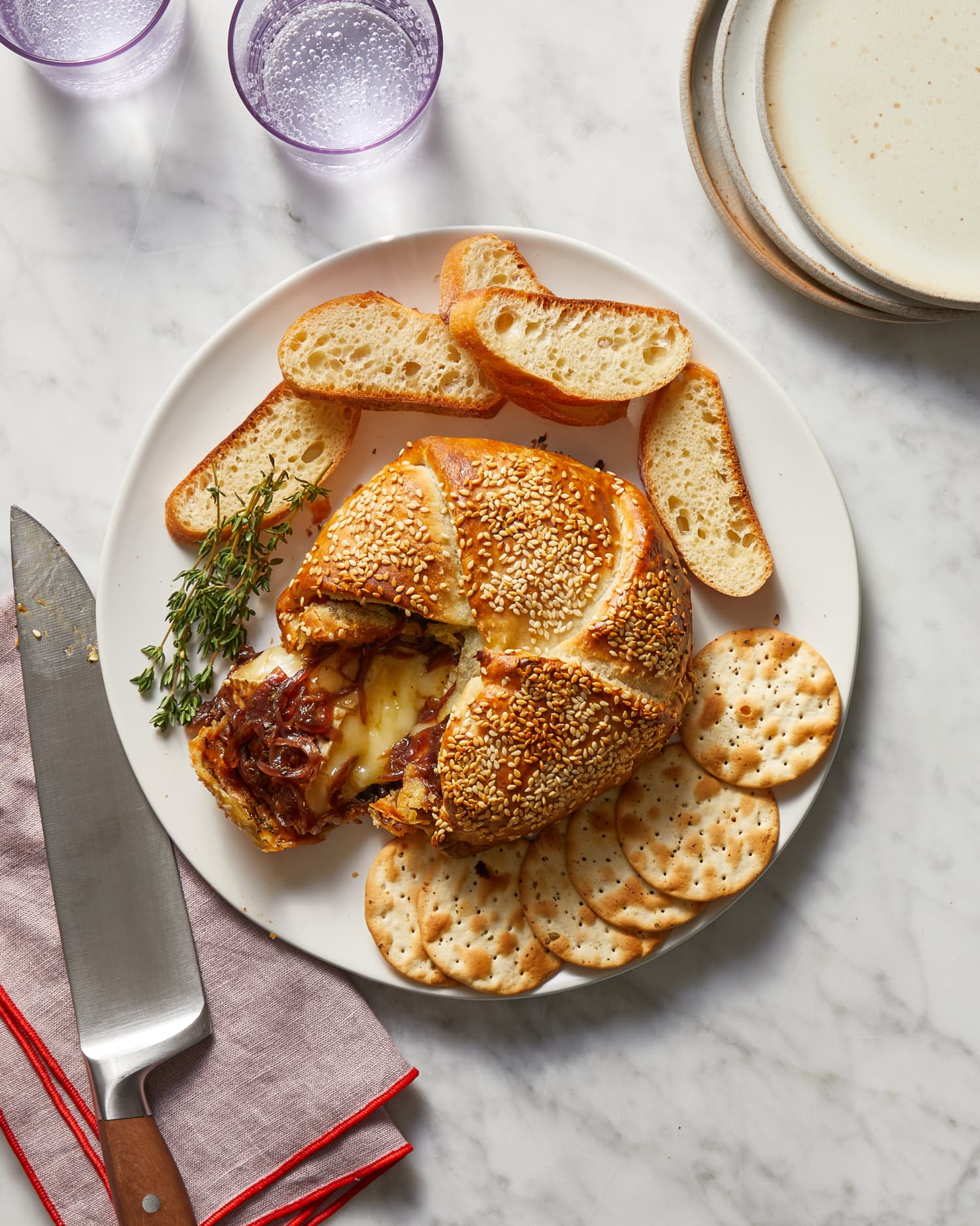 This Gooey Caramelized Onion Baked Brie Has French Onion Soup Vibes