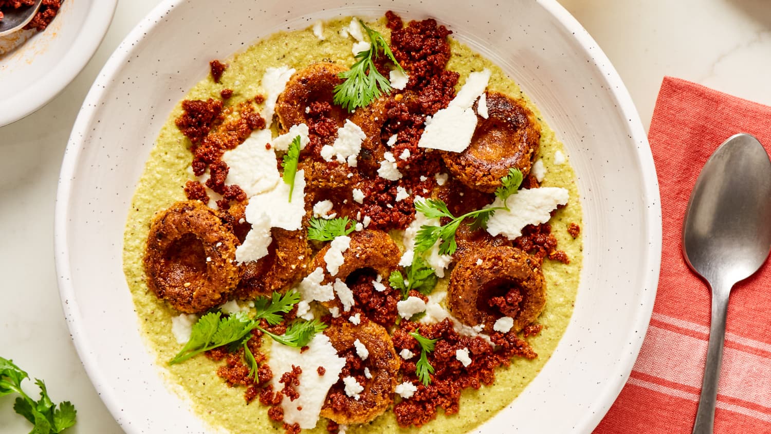Chorizo Chochoyotes in Pistachio Mole Verde with Ranchero Queso Fresco Recipe-image