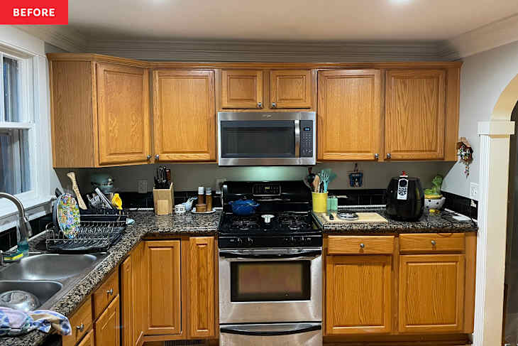 Wooden cabinets in kitchen before renovation.