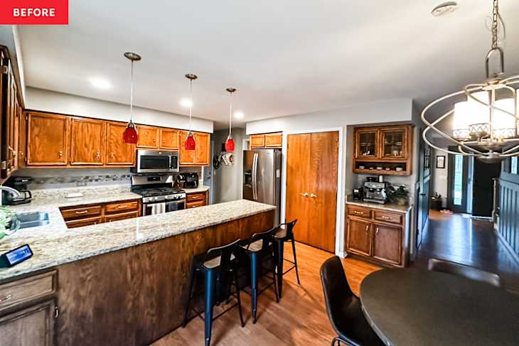 Kitchen with brown wood cabinetry, peninsula, and flooring before renovation.