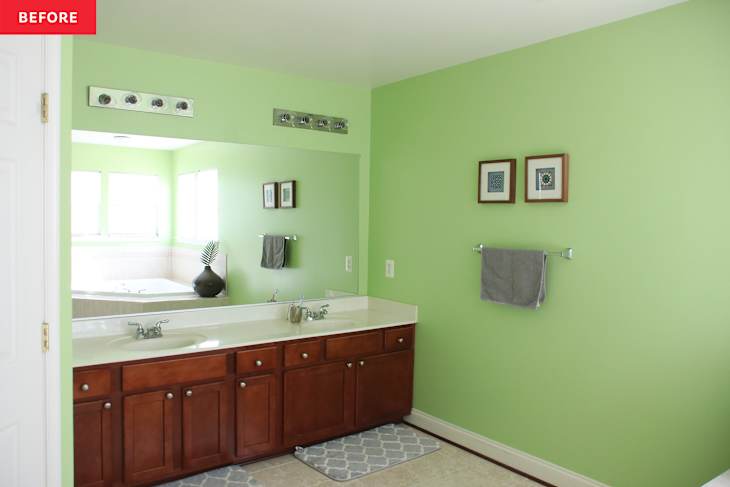 Wooden large vanity in green painted bathroom before renovation.