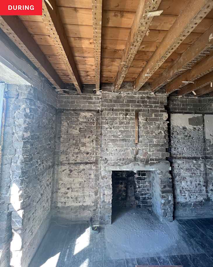 Living room stripped down to the bricks during construction