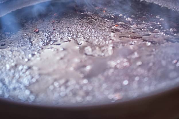 If You Want to Safely Clean Your Pan (but the Grease Is Still Hot), Try This