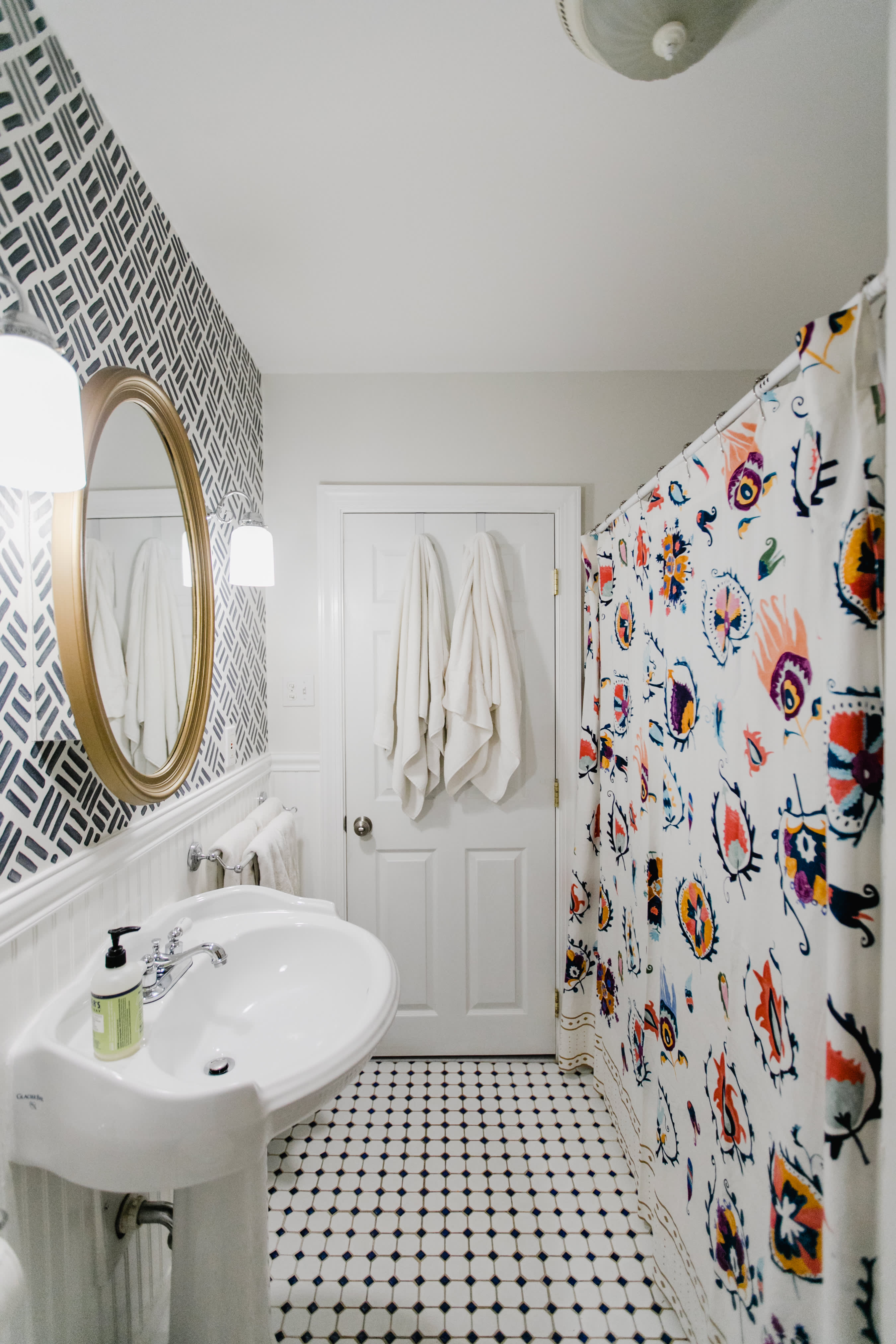 Add extra storage with an extra shower curtain rod, then all you have to so  is…