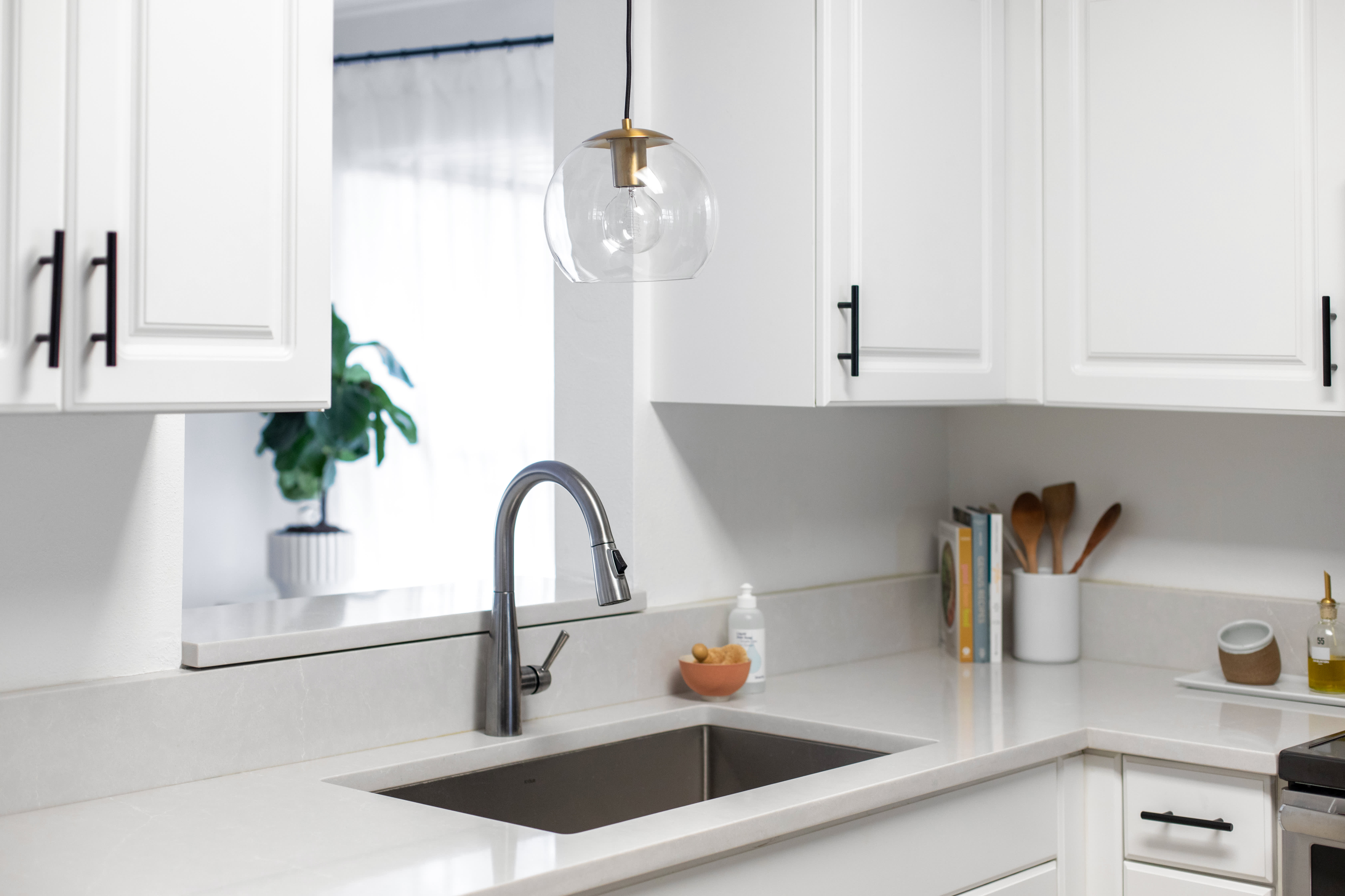 above the kitchen sink light fixture