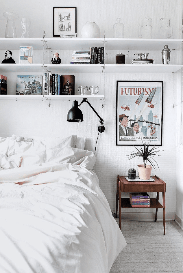 floating shelves above nightstand