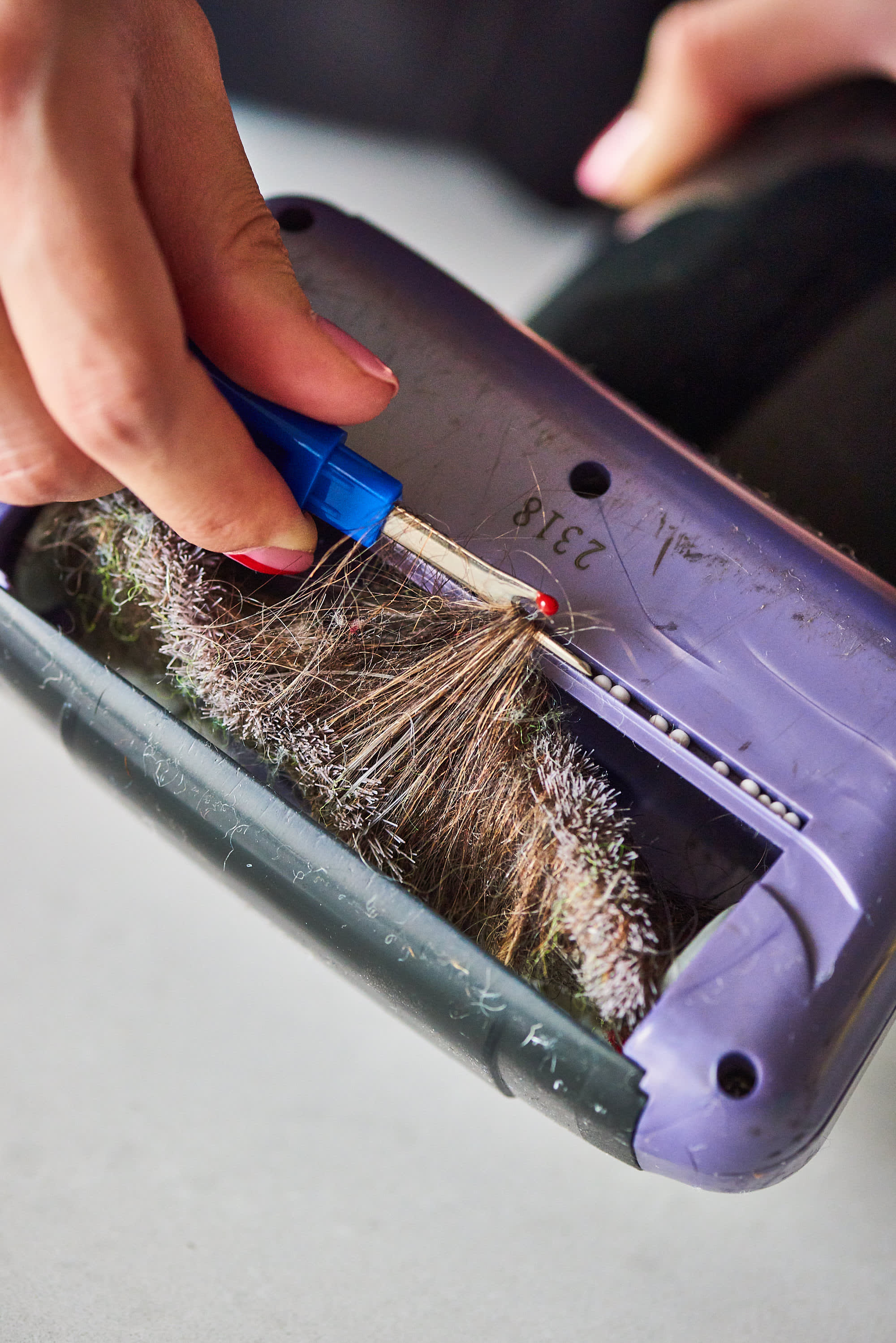 Use a seam ripper to get hair out of vacuum roller brushes. : r