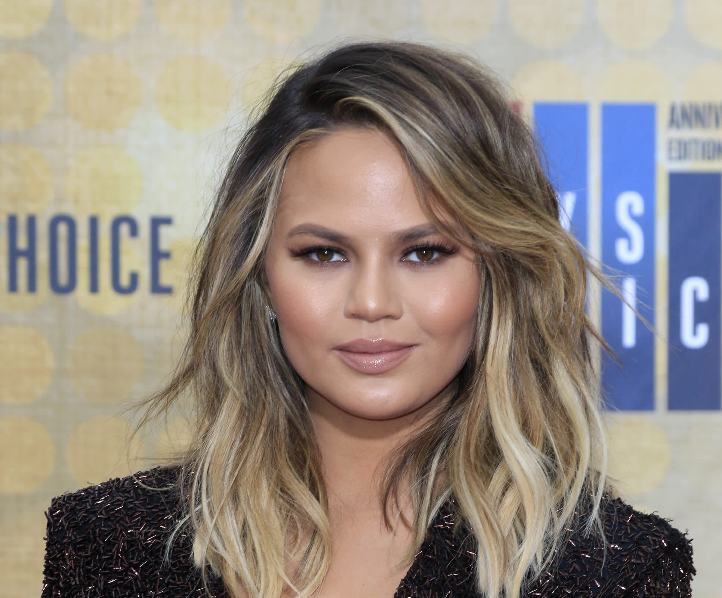 Chrissy Teigen's crazy cheese wheel Christmas present, explained