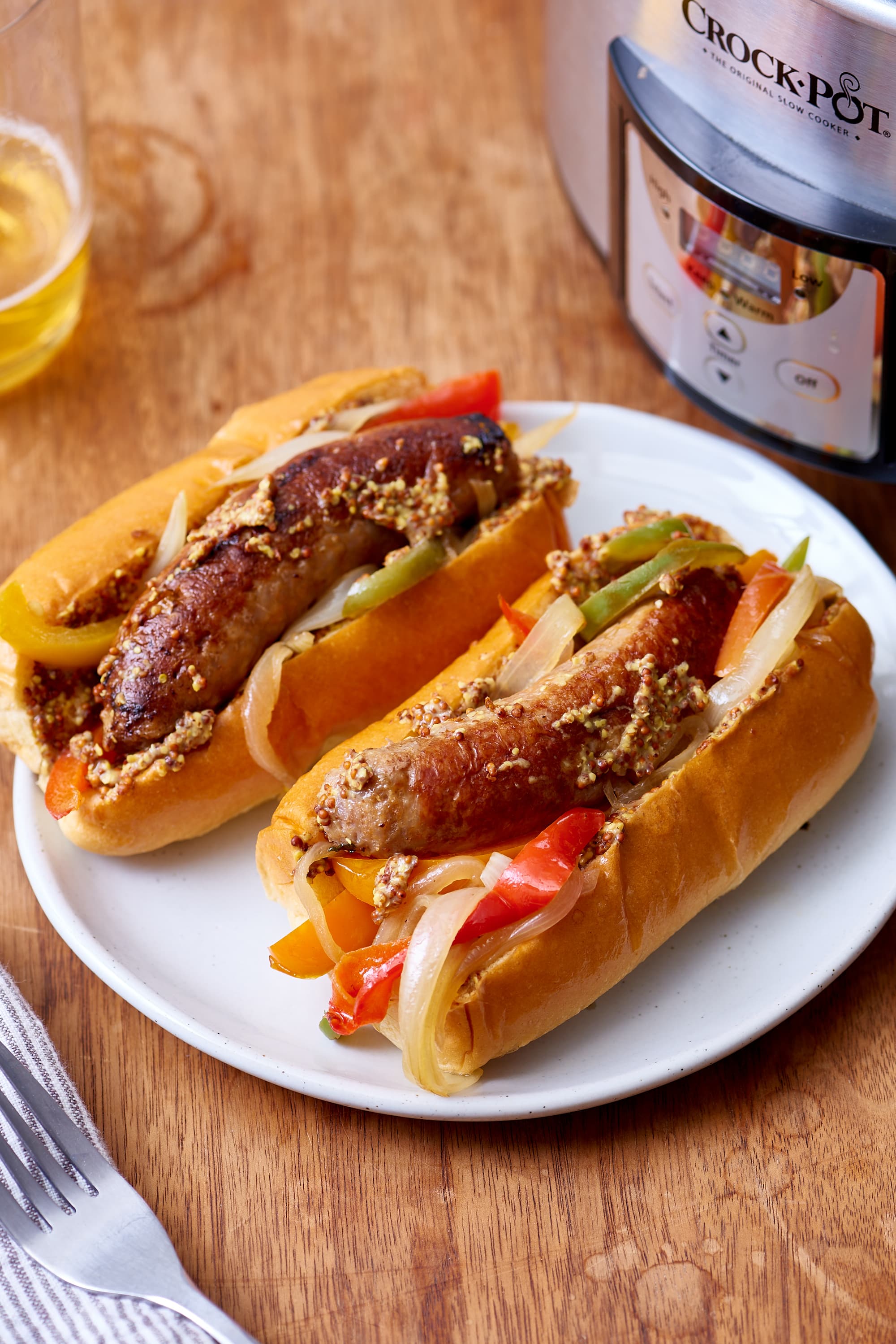 Slow Cooker Brats with Onions and Peppers - Cooking With Carlee