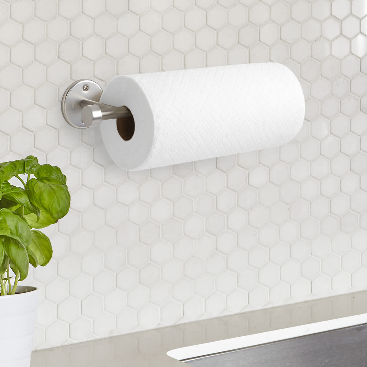 This $10 Paper Towel Holder Sticks Onto The Wall And Saves Counter Space