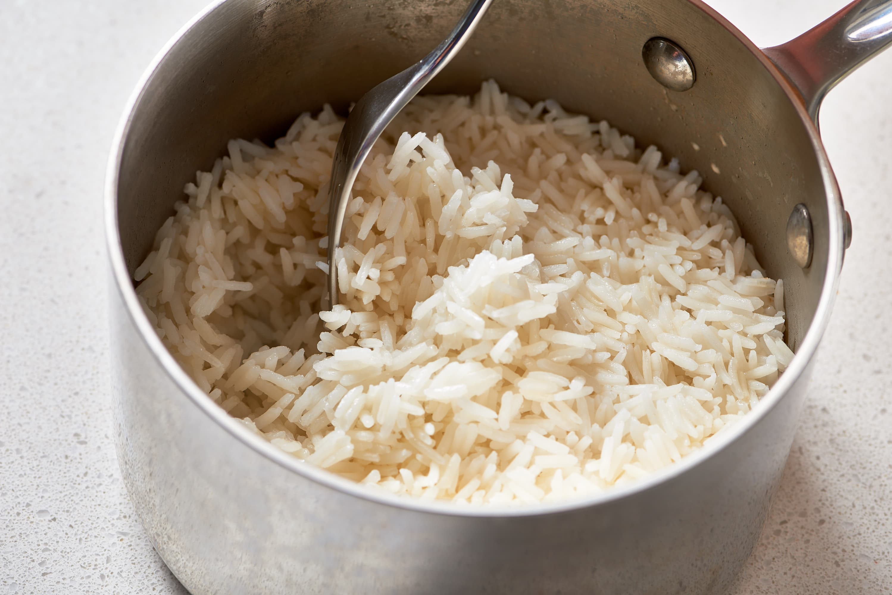 cooking rice in a pot on the stove