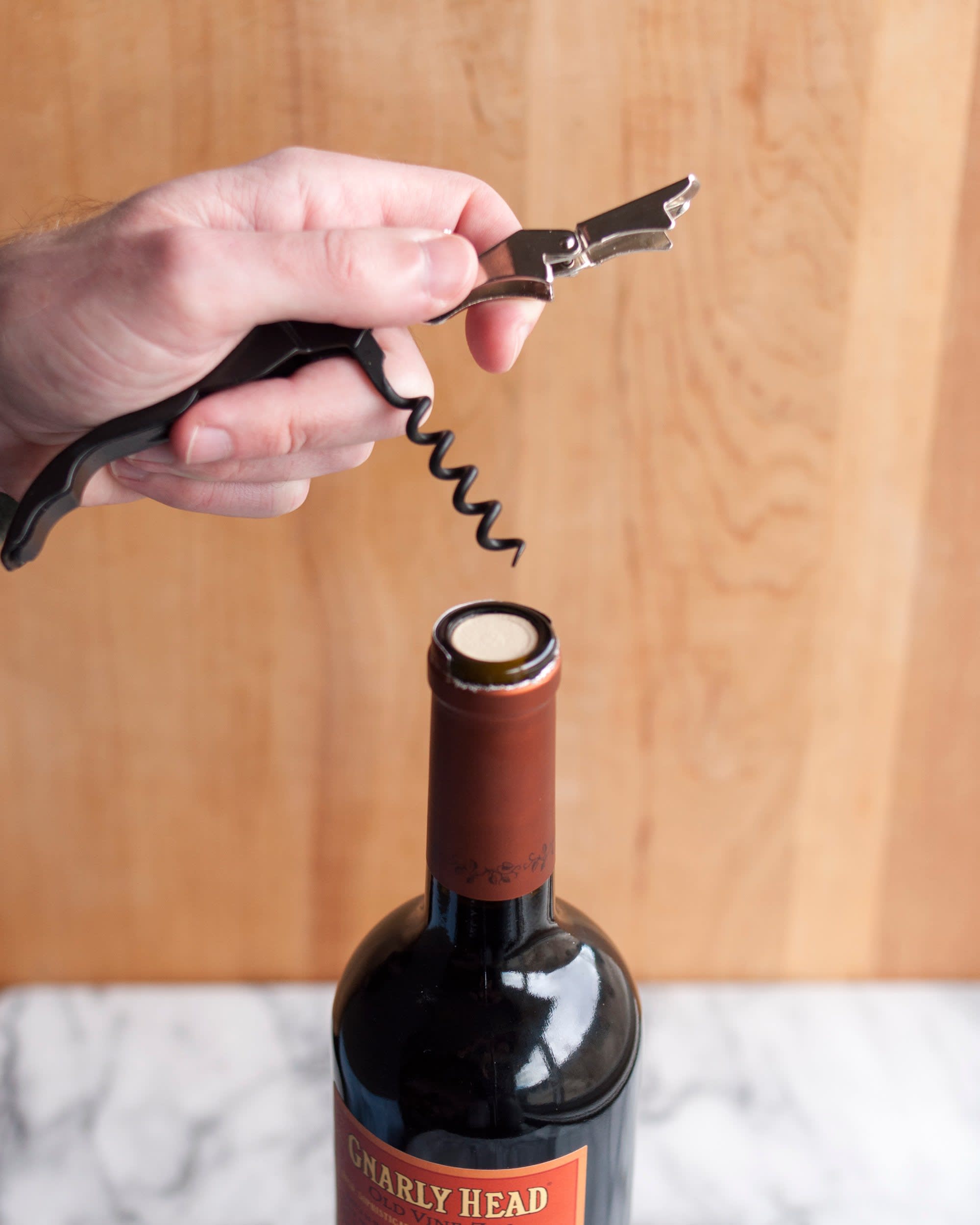 how to open a wine bottle with a key