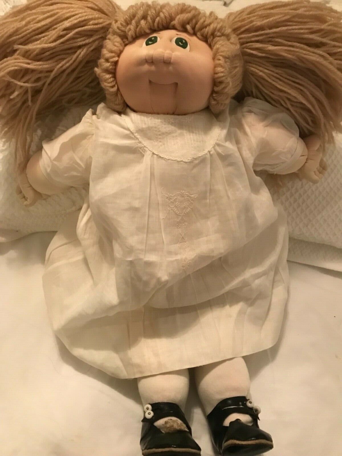 cabbage patch doll with pigtails