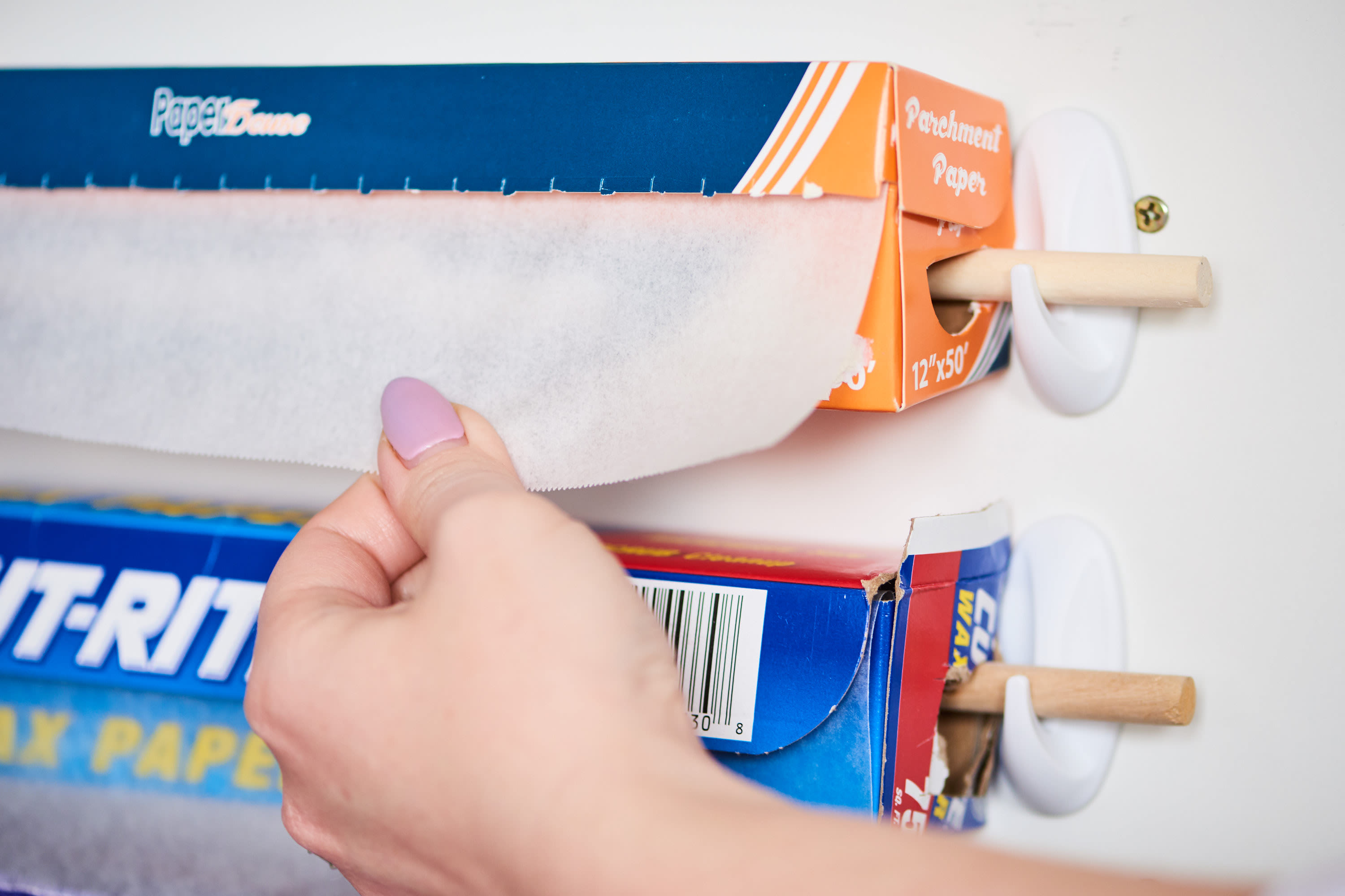 Aha! Hack: Tension Rod as Paper Towel Holder - The Organized Home