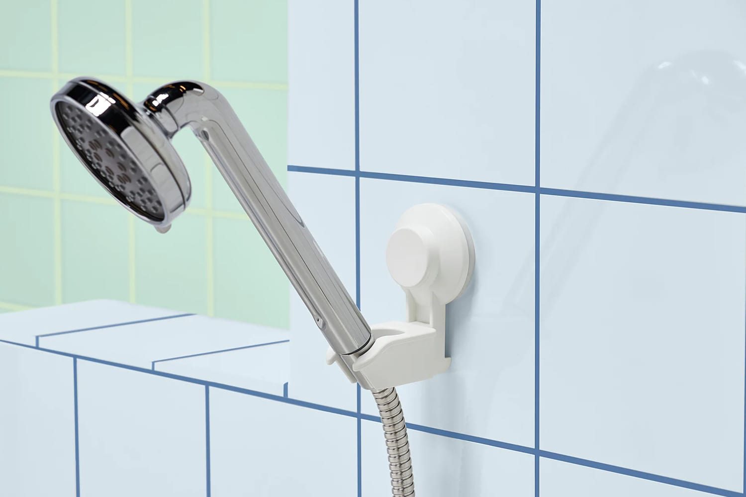 https://cdn.apartmenttherapy.info/image/upload/v1562947103/at/living/renter-bath-organizers-ikea-showerhead-holder.jpg