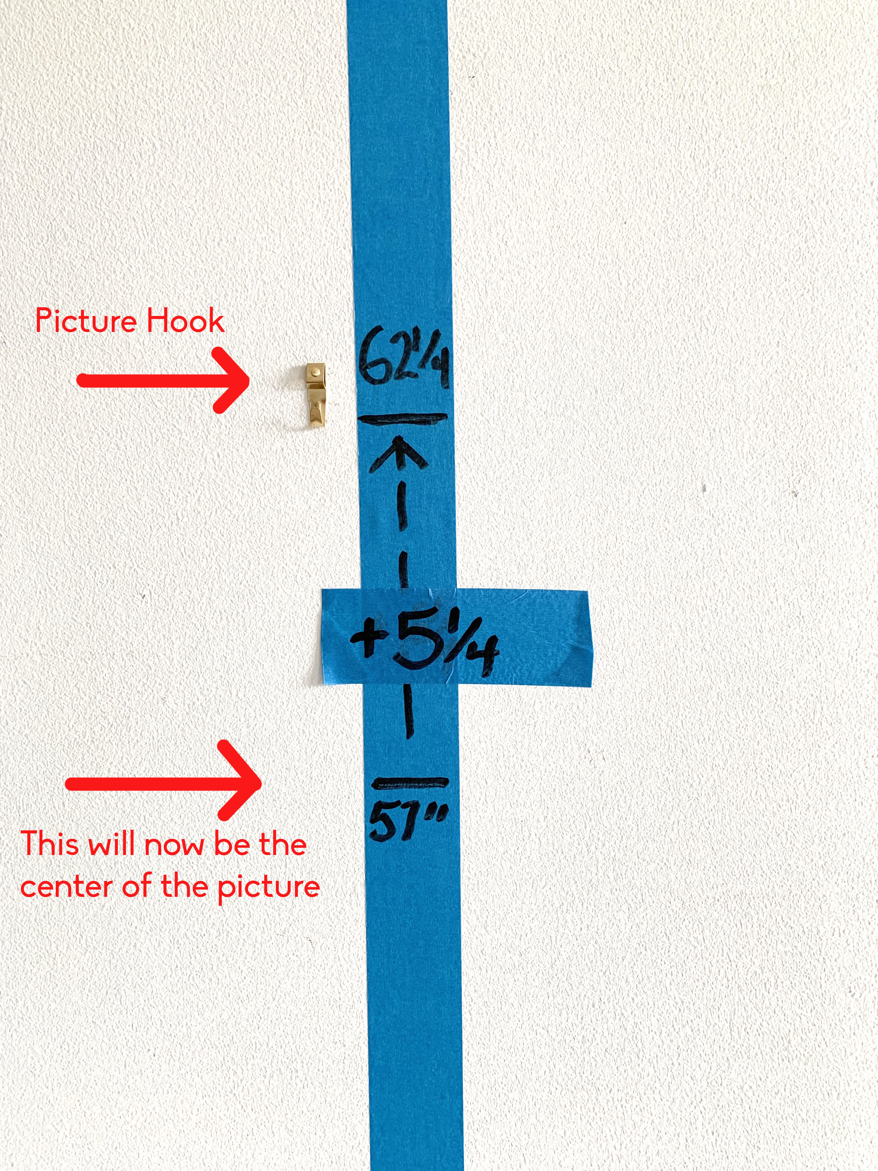 Hack shows how to hang a picture perfectly without a measuring