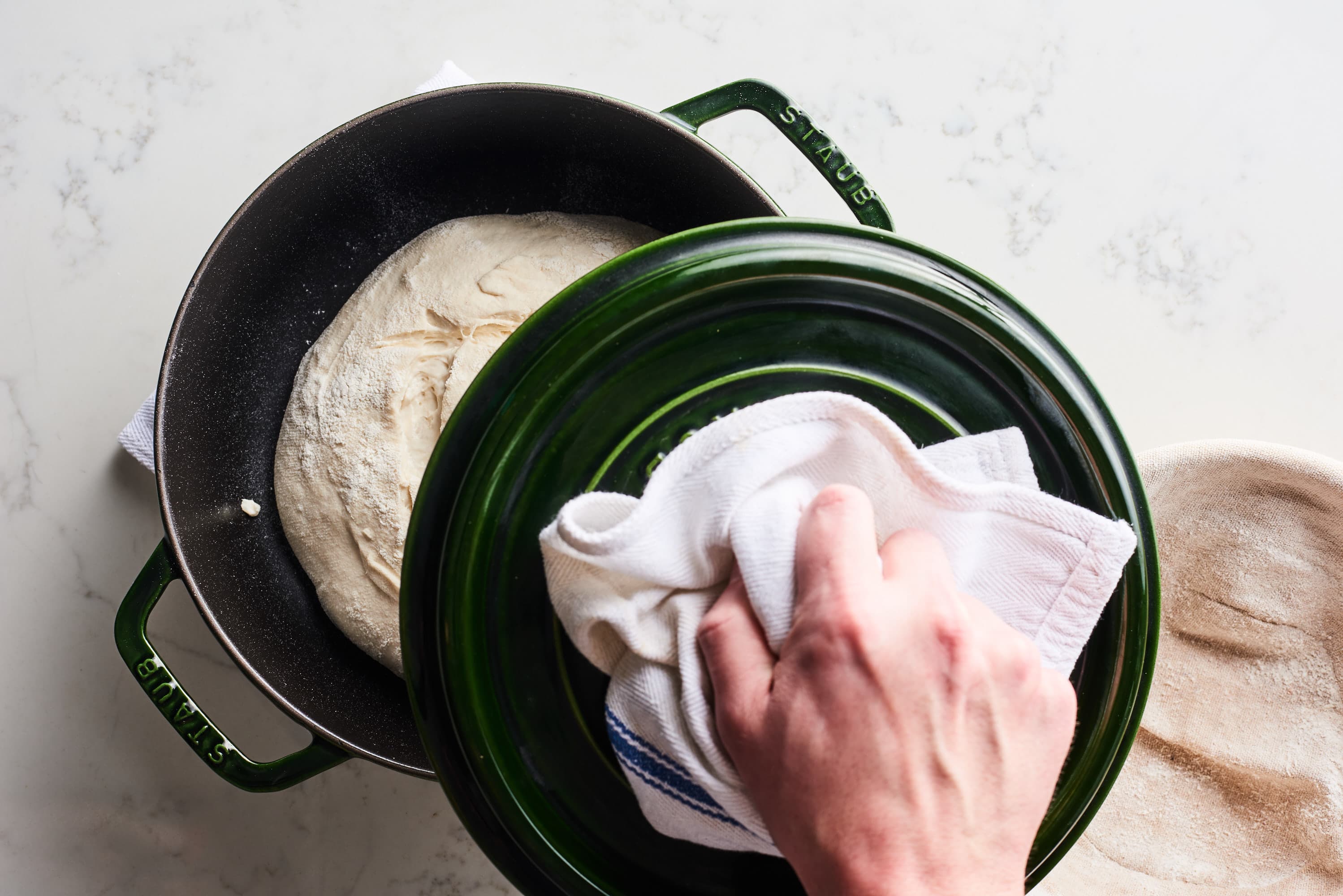 https://cdn.apartmenttherapy.info/image/upload/v1579298798/k/Photo/Recipes/2020-01-How-to-Sourdough-Bread/98733-putting-lid_How-to-make-sourdough-bread.jpg