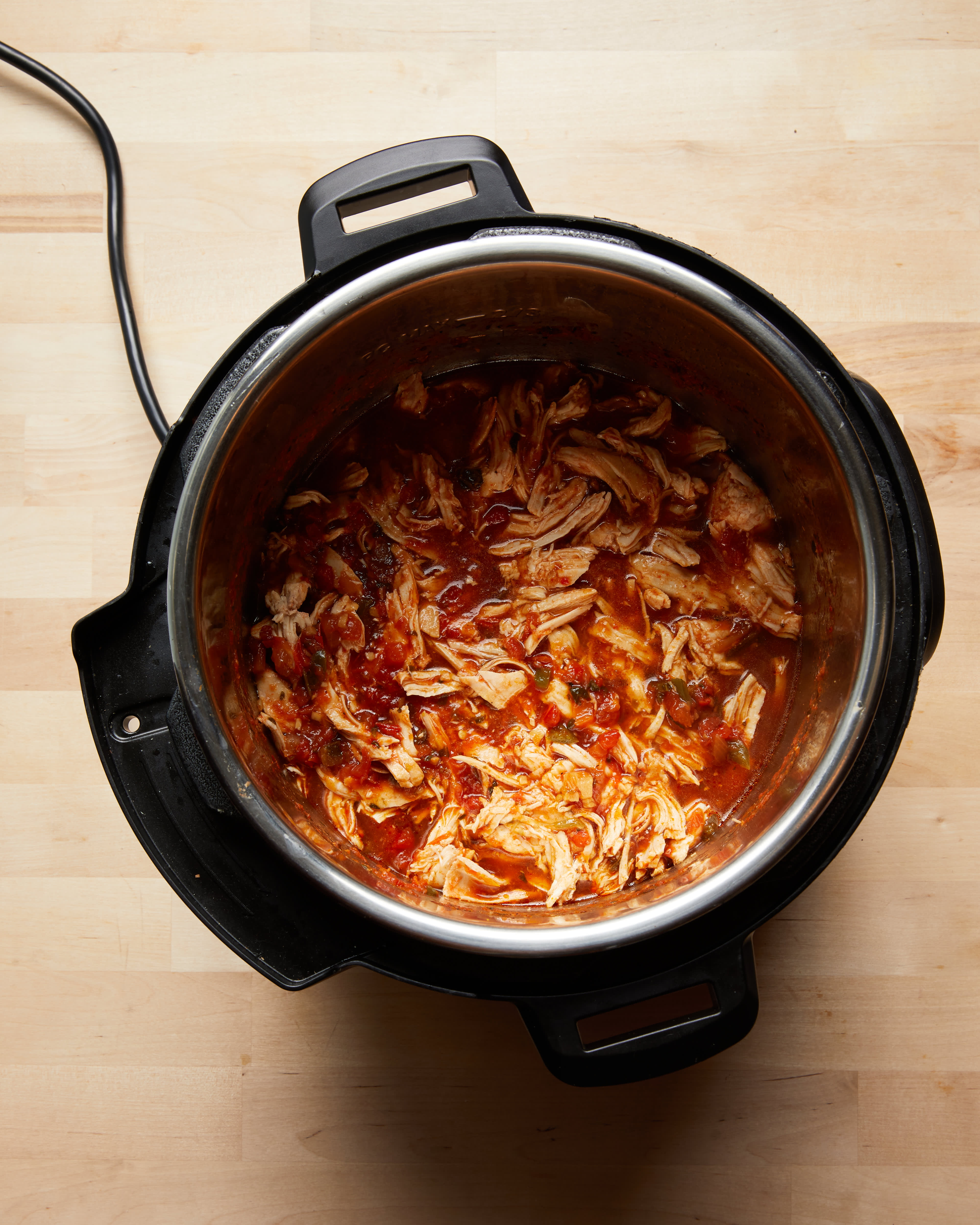 Instant Pot Shredded Salsa Chicken - Evolving Table