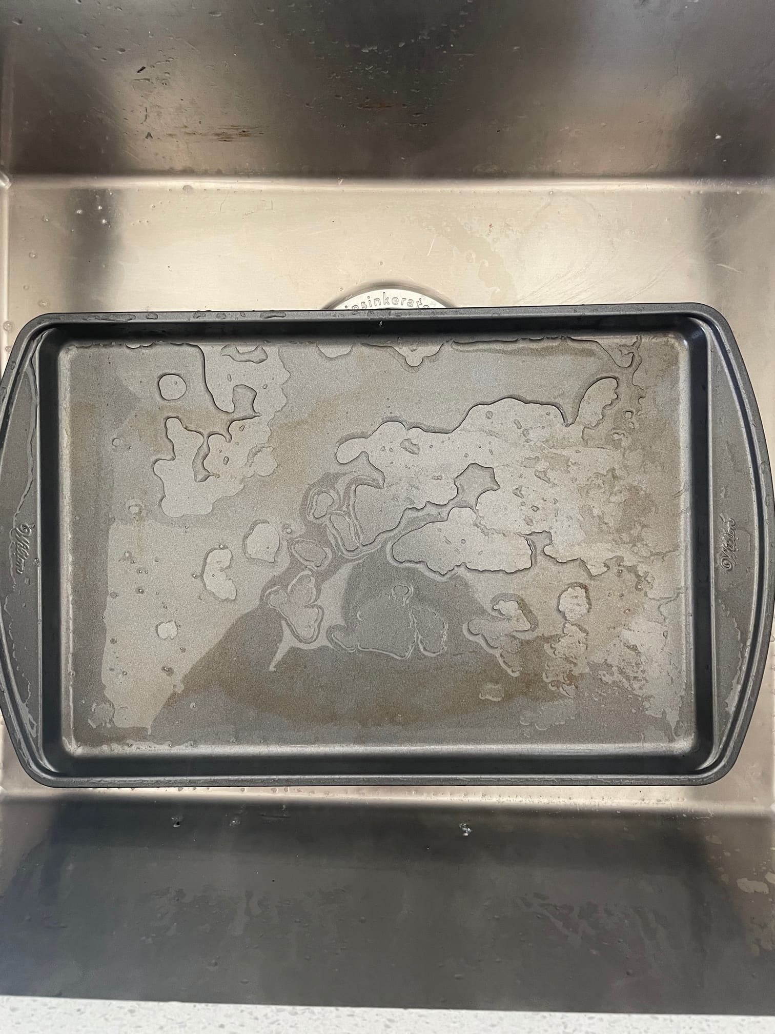 My bf put my quarter sheet pans in the dish washer, how can I get the shine  back? : r/Baking