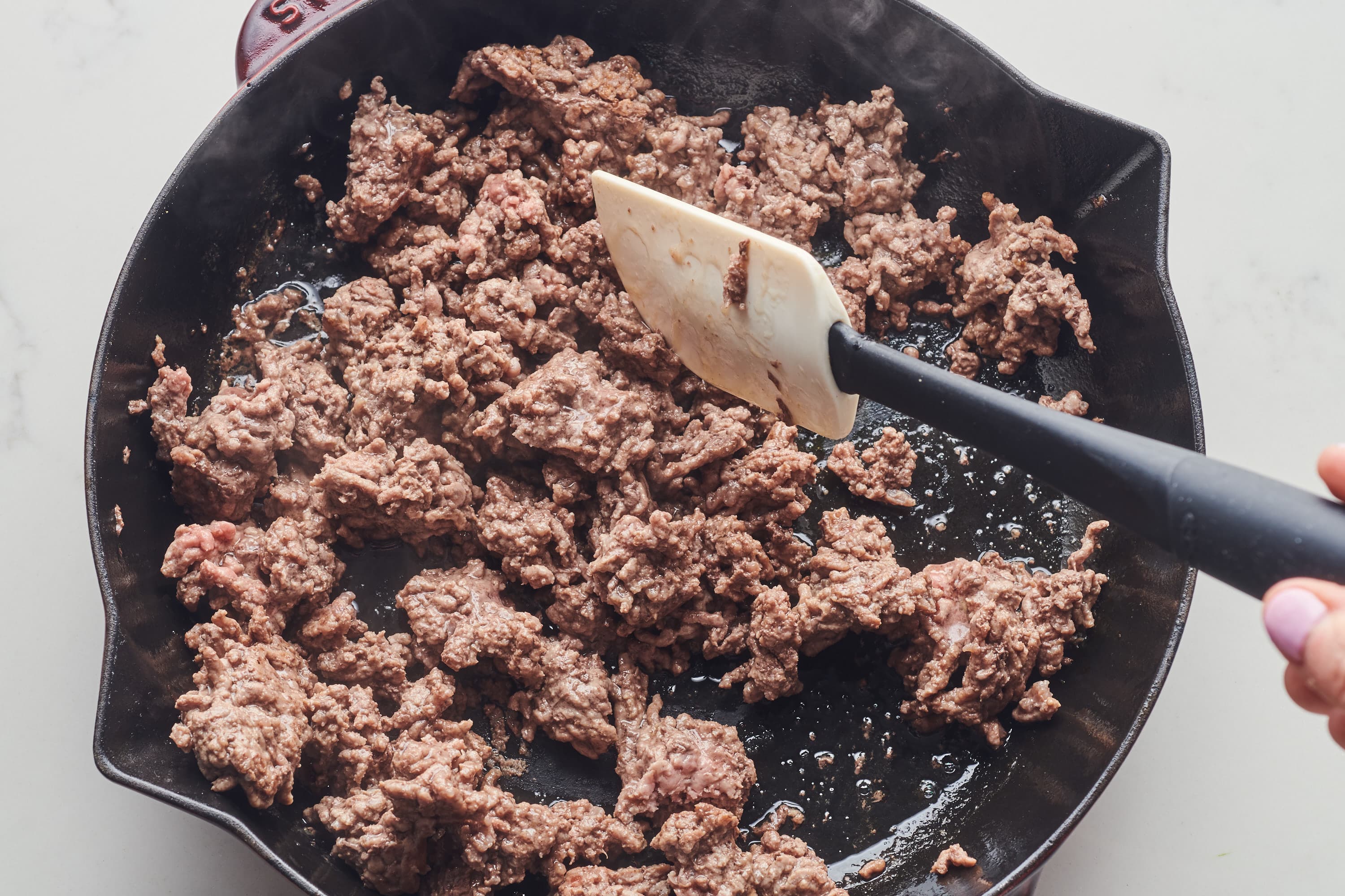 What's the secret to browning ground beef into small crumbly