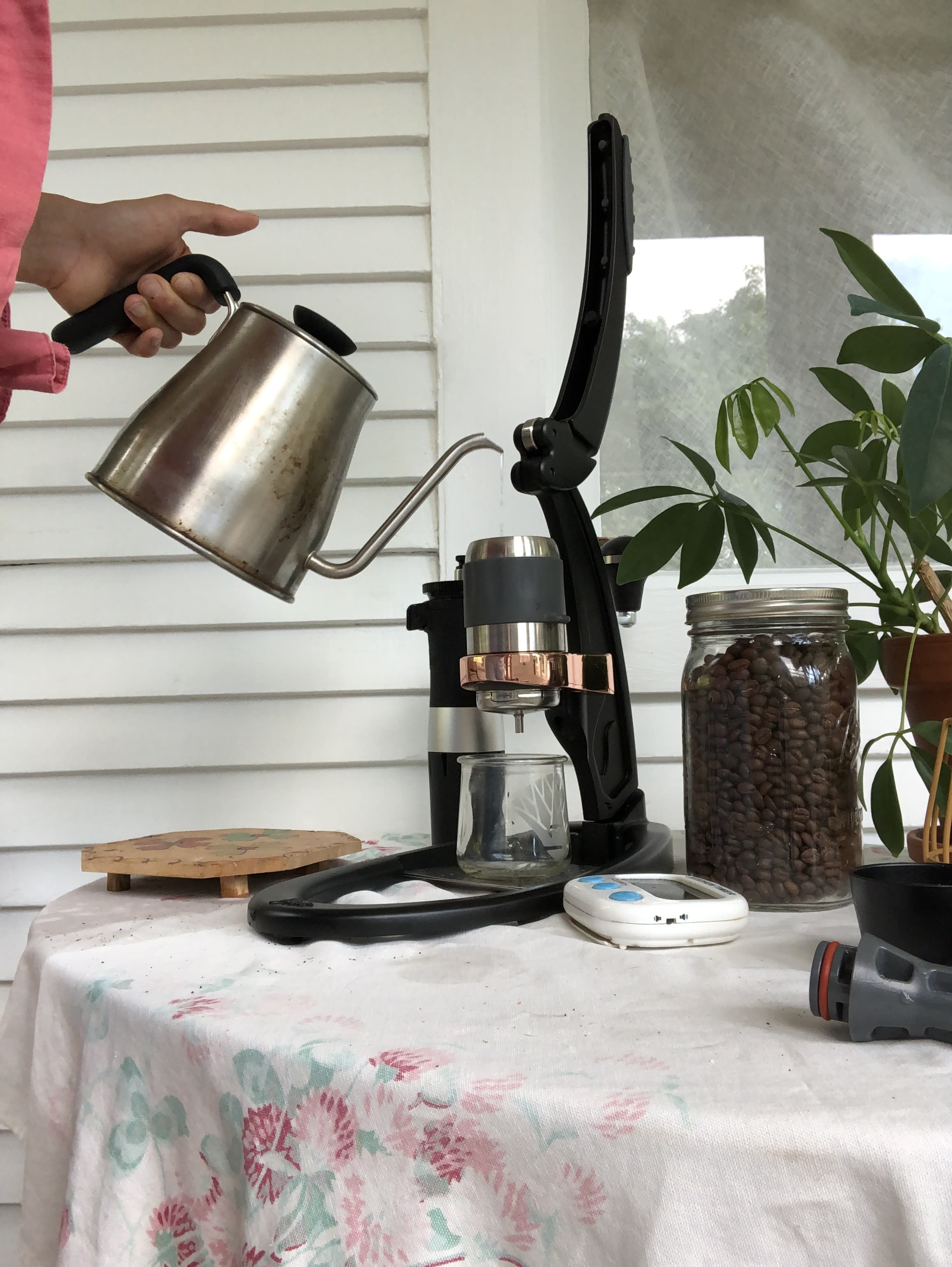 A Barista Using The Flair Espresso Maker Is A Non-electric Coffee Brewing  Device Using A Lever Or Handle. For Extracting Espresso On A Table With  Coffee Making Iced Coffee. Soft Focus Stock