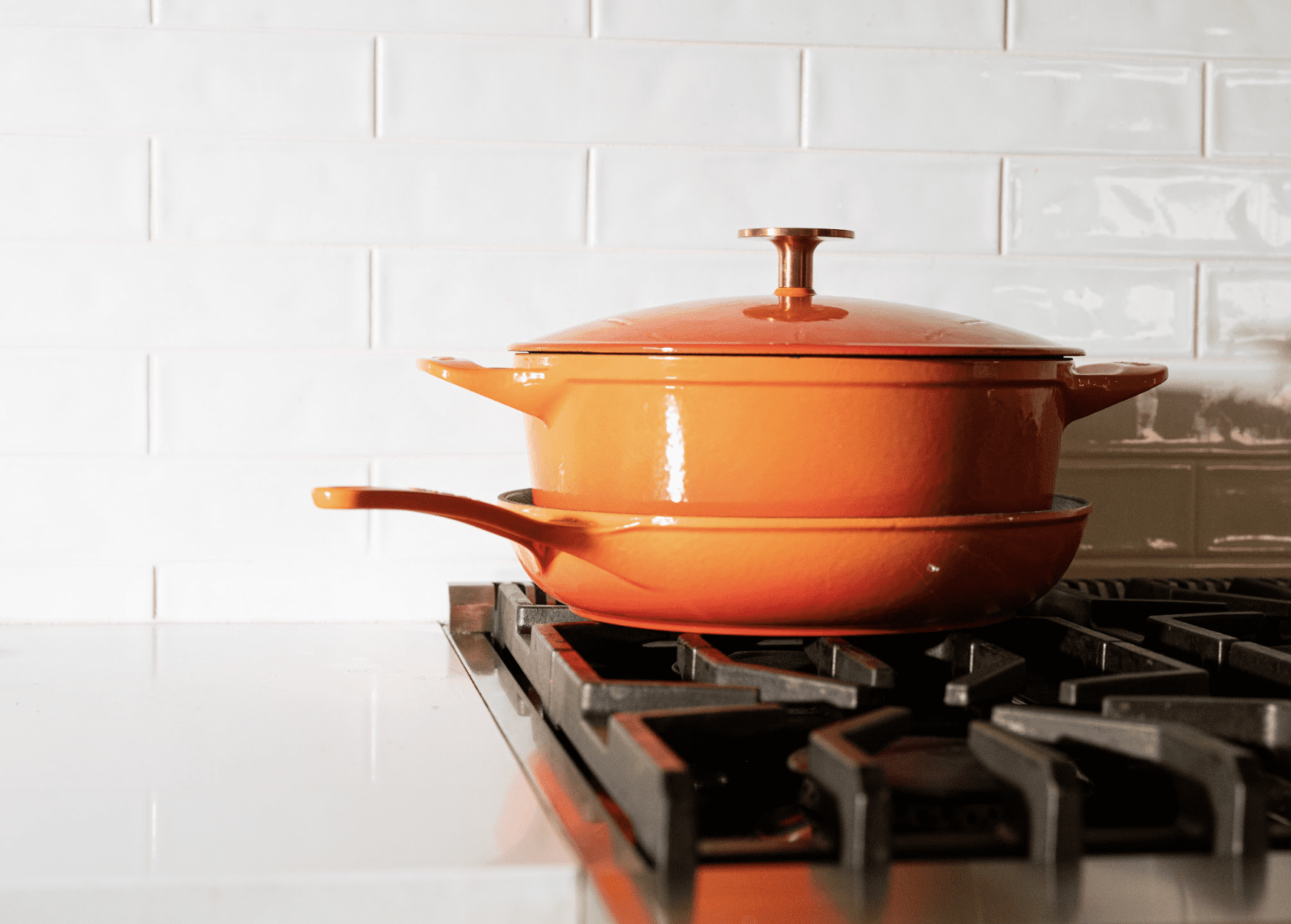 https://cdn.apartmenttherapy.info/image/upload/v1670517917/commerce/Made-In-Orange-Enameled-Cast-Iron-Set.png