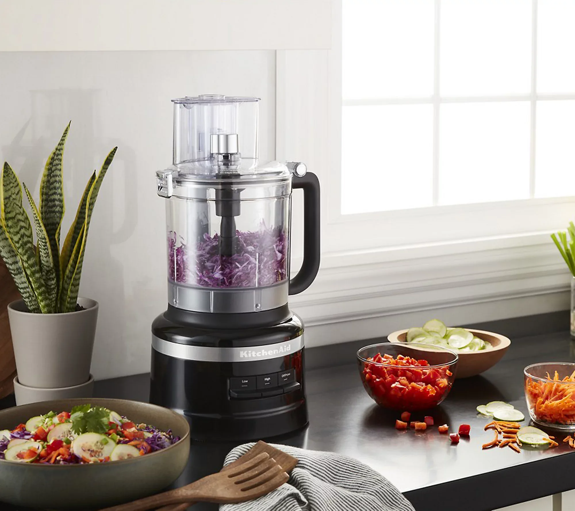 https://cdn.apartmenttherapy.info/image/upload/v1674840026/commerce/qvc-KitchenAid-13-Cup-Food-Processor-Plus-Dicing-Kit-lifestyle.webp