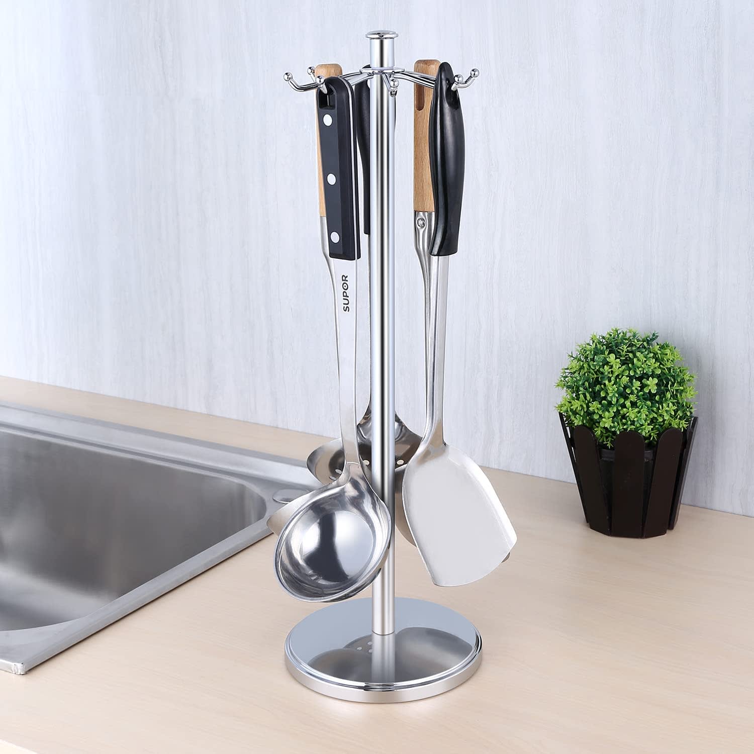 https://cdn.apartmenttherapy.info/image/upload/v1675703661/commerce/MAYZOLOP-Countertop-Rotatable-Utensil-Holder-amazon-lifestyle-2.jpg