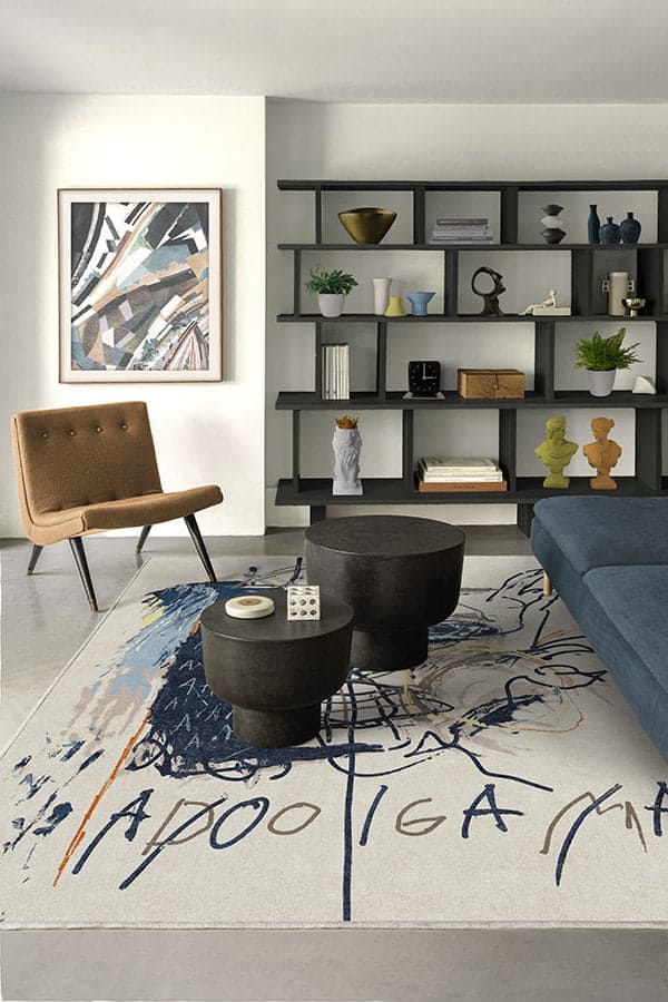 https://cdn.apartmenttherapy.info/image/upload/v1681416146/commerce/Jean-Michel-Basquiat-Apologia-Ivory-Blue-Rug-ruggable.jpg