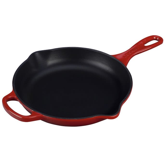 https://cdn.apartmenttherapy.info/image/upload/v1691422353/commerce/Le-Creuset-Signature-Skillet-red.jpg