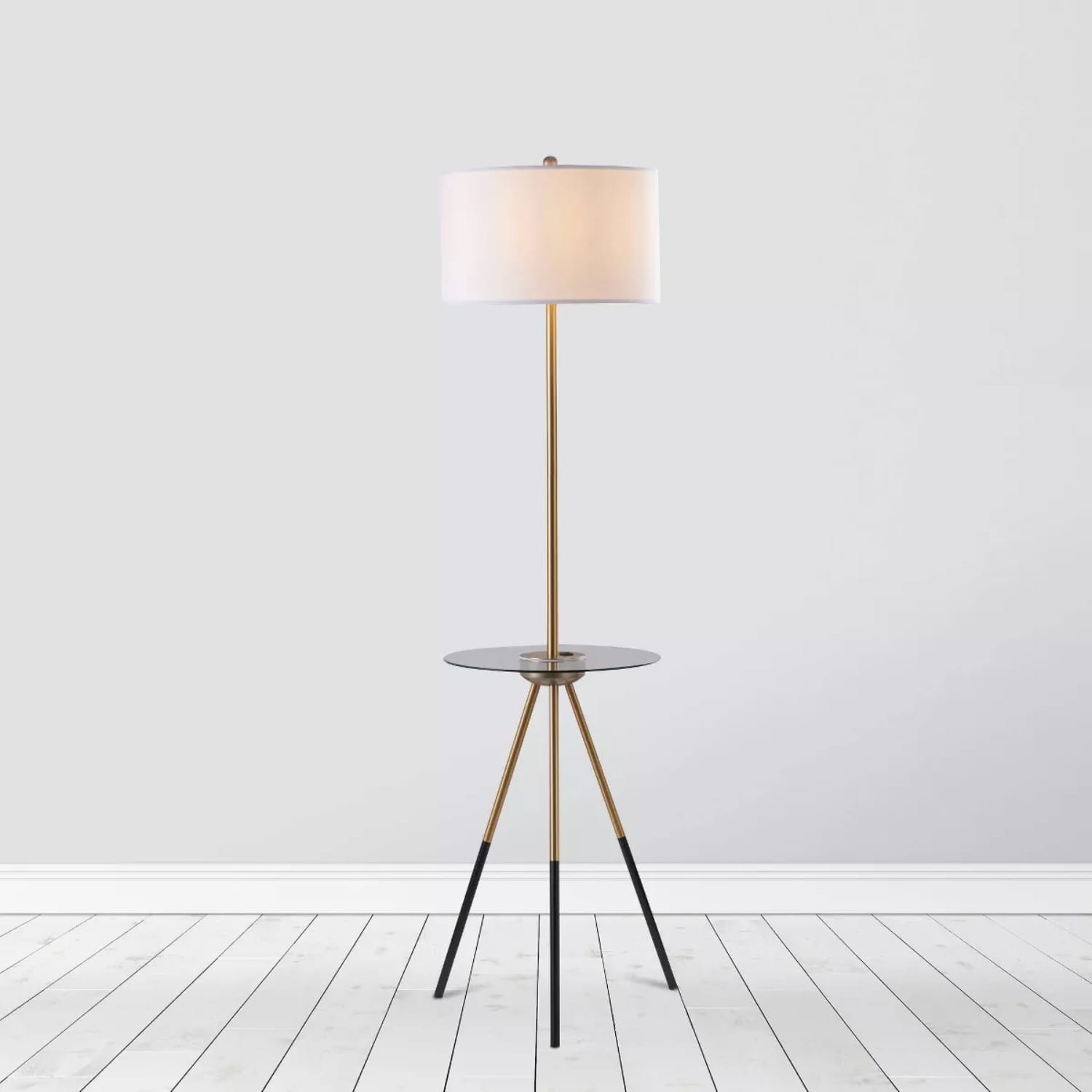 https://cdn.apartmenttherapy.info/image/upload/v1693588490/at/living/2023-09/studio-apartment-essentials/tripod-floor-lamp.jpg