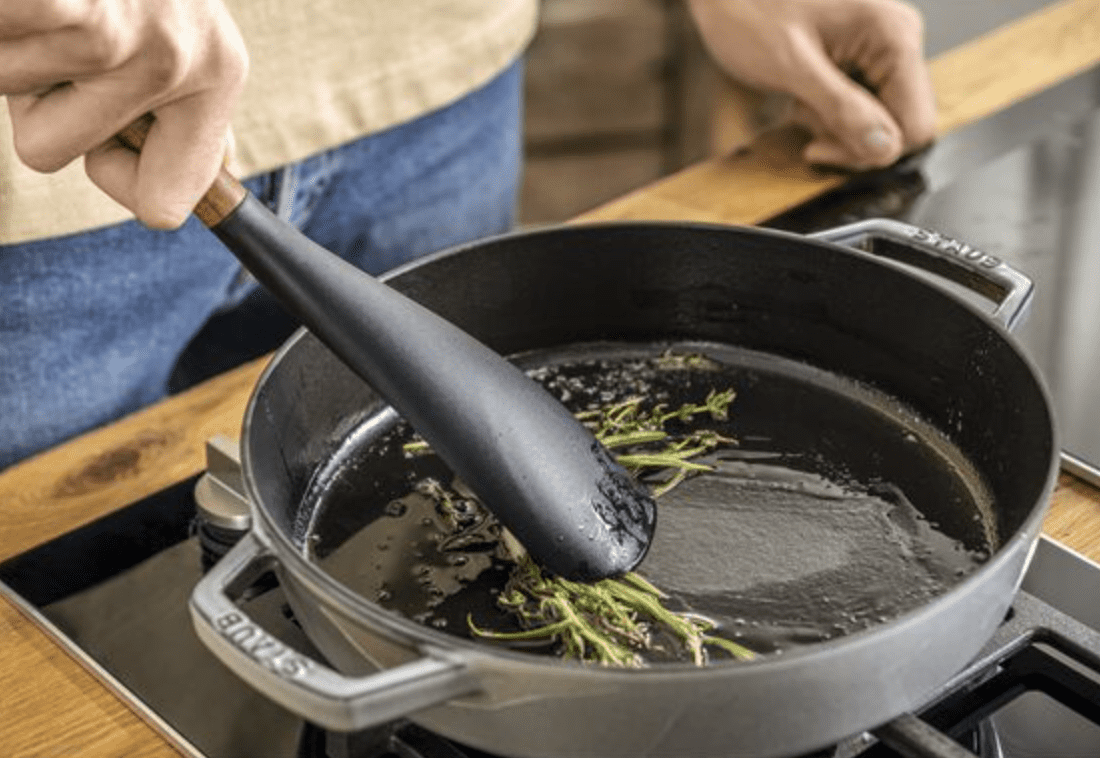 https://cdn.apartmenttherapy.info/image/upload/v1694031759/commerce/Zwilling-Staub-Multi-Function-Spoon-Lifestyle.png