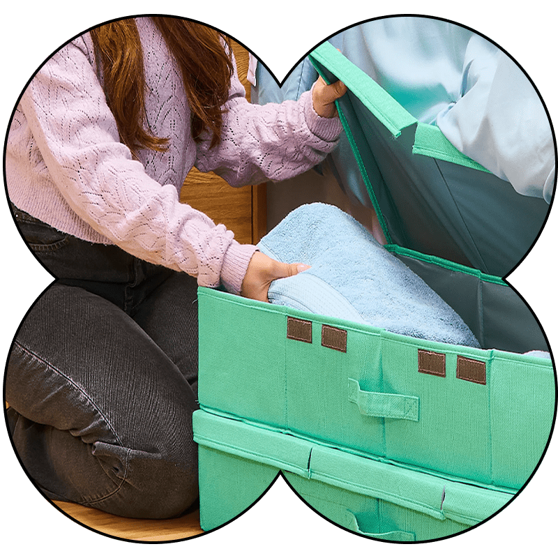 Person packing clothes into a box