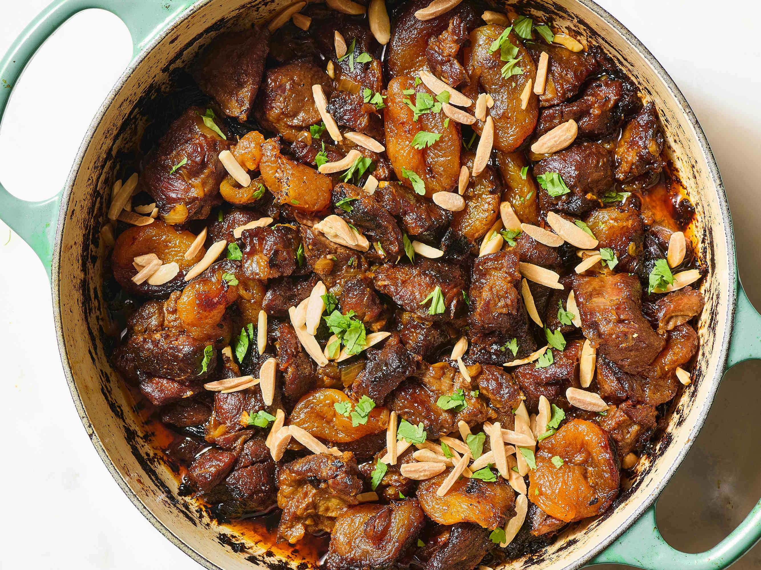 Finished lamb tagine garnished with almonds